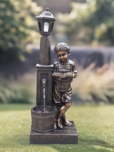 Boy Reading at Lamp Water Feature